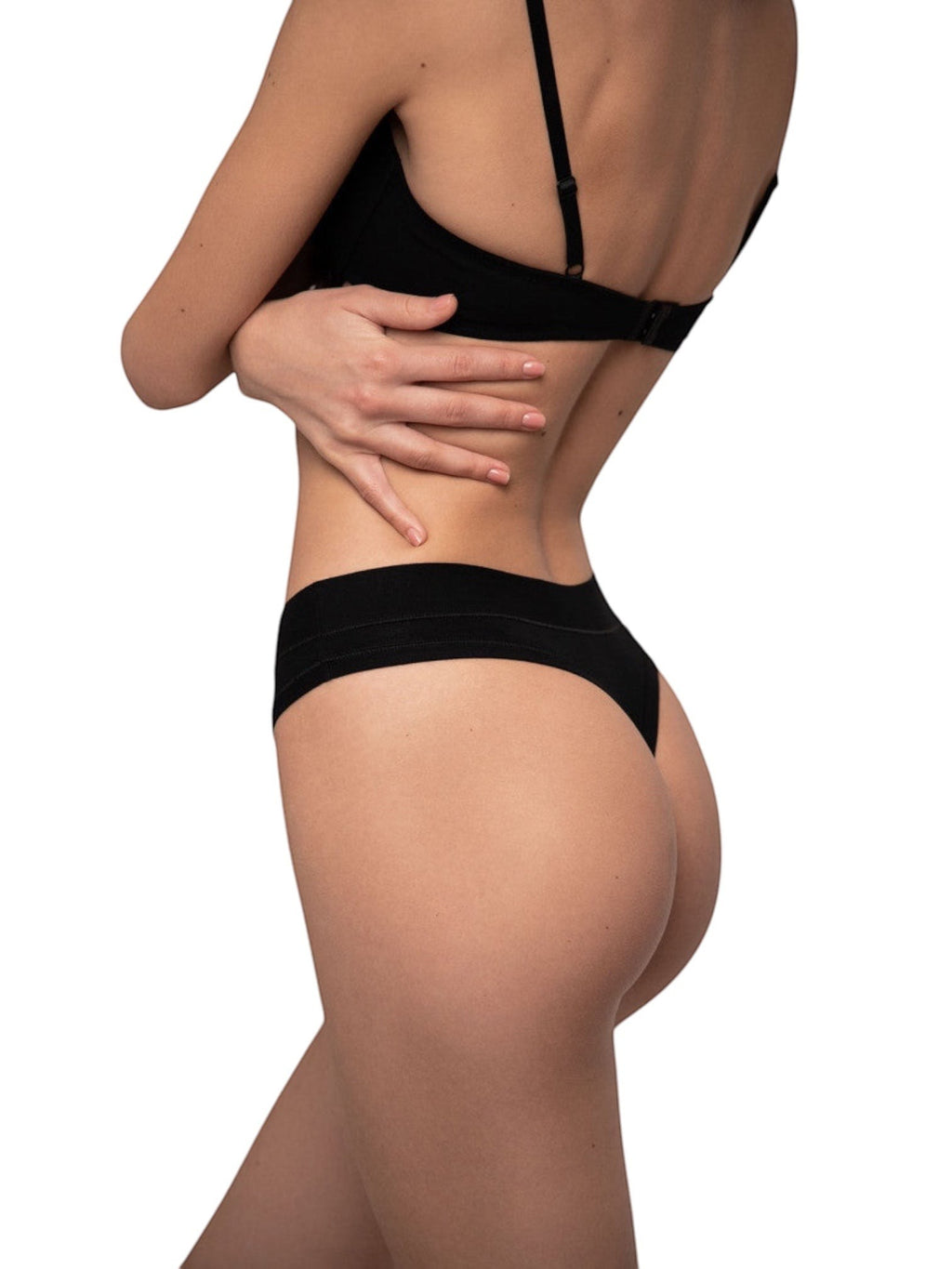 LIA STUDIO LINGERIE Amelia black cotton thong panties with comfortable elastic inserts on a model side view