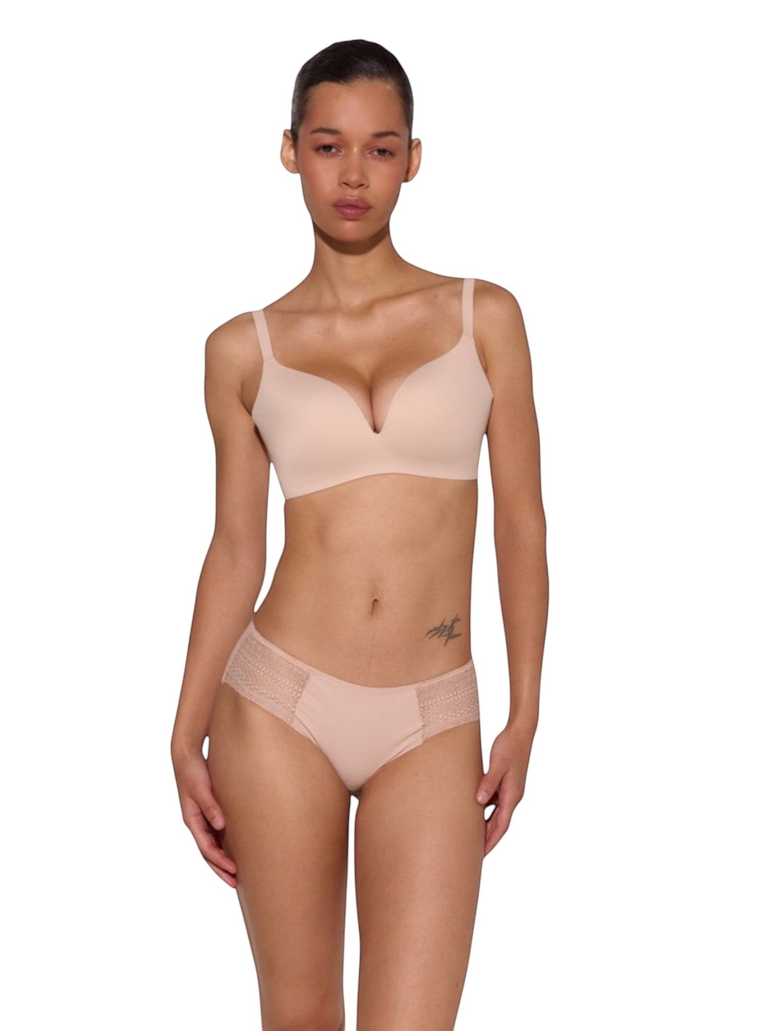 Model wearing LIA STUDIO LINGERIE Bra Marita in beige, featuring seamless moulded polyamide cups and a smooth fit.