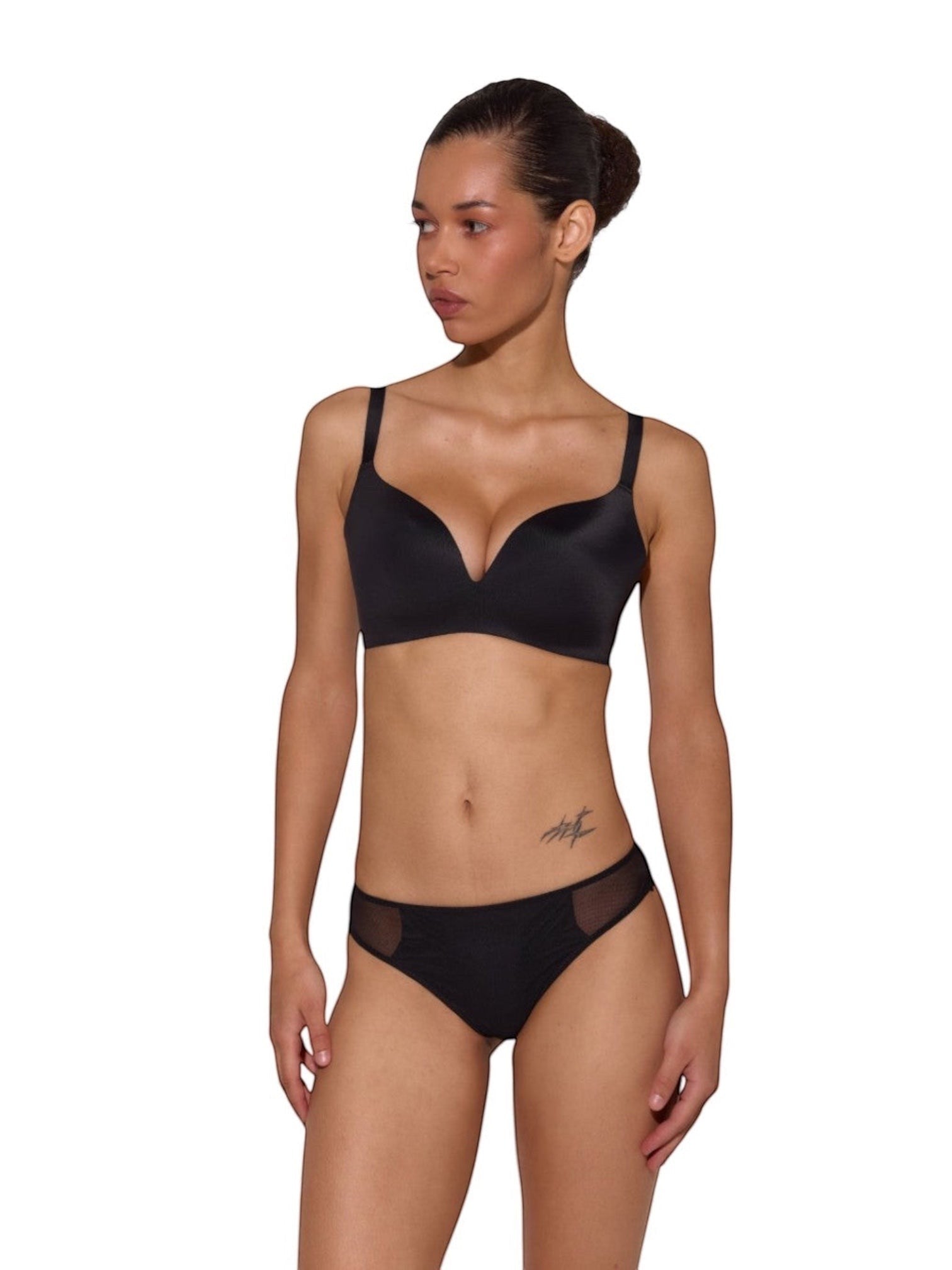 Model wearing LIA STUDIO LINGERIE Marita black seamless moulded polyamide bra with laser-cut edges