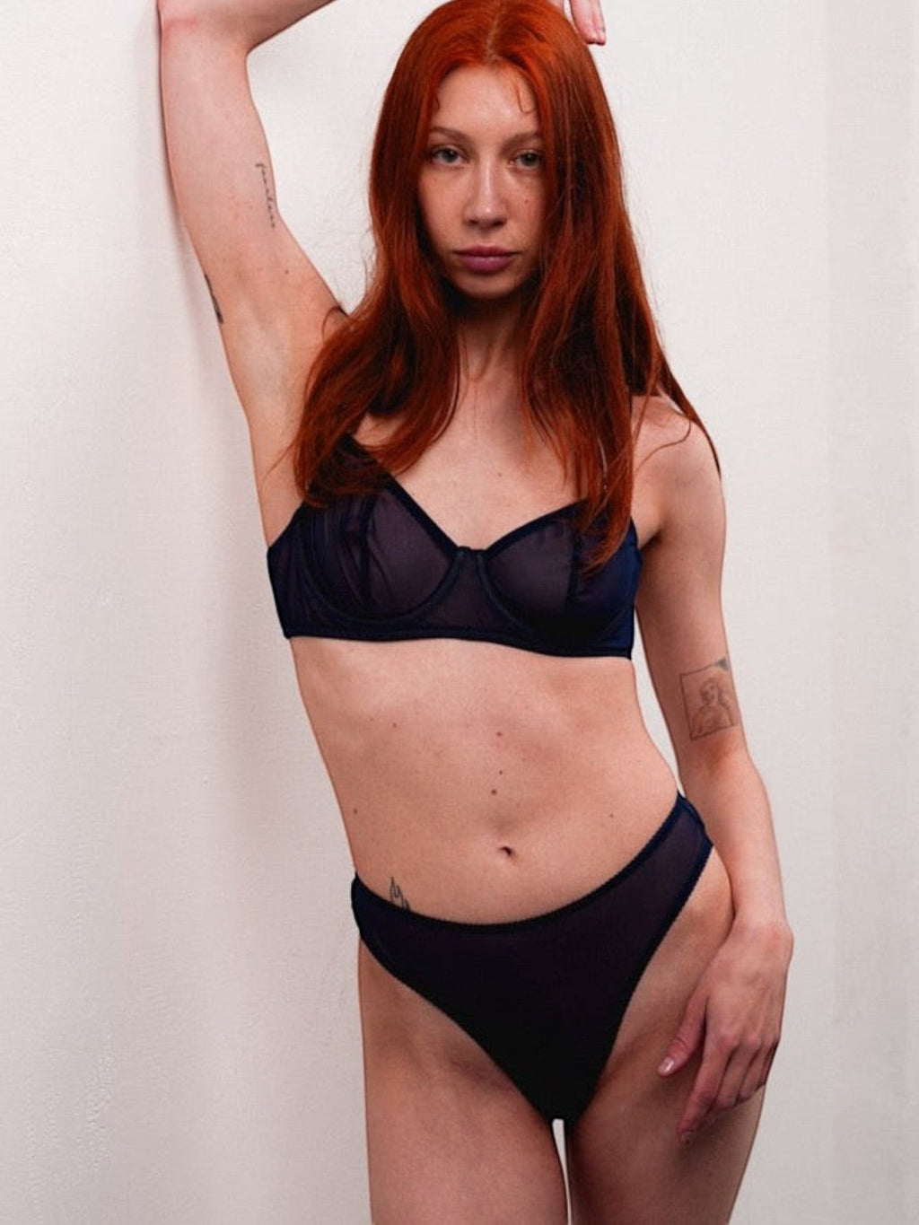 LIA STUDIO LINGERIE custom navy mesh bra and matching high-cut panty worn by a model with red hair.