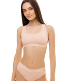 LIA STUDIO LINGERIE Sherly: a beige cotton-spandex sports bra with a sporty cut, wide straps, and no fasteners.