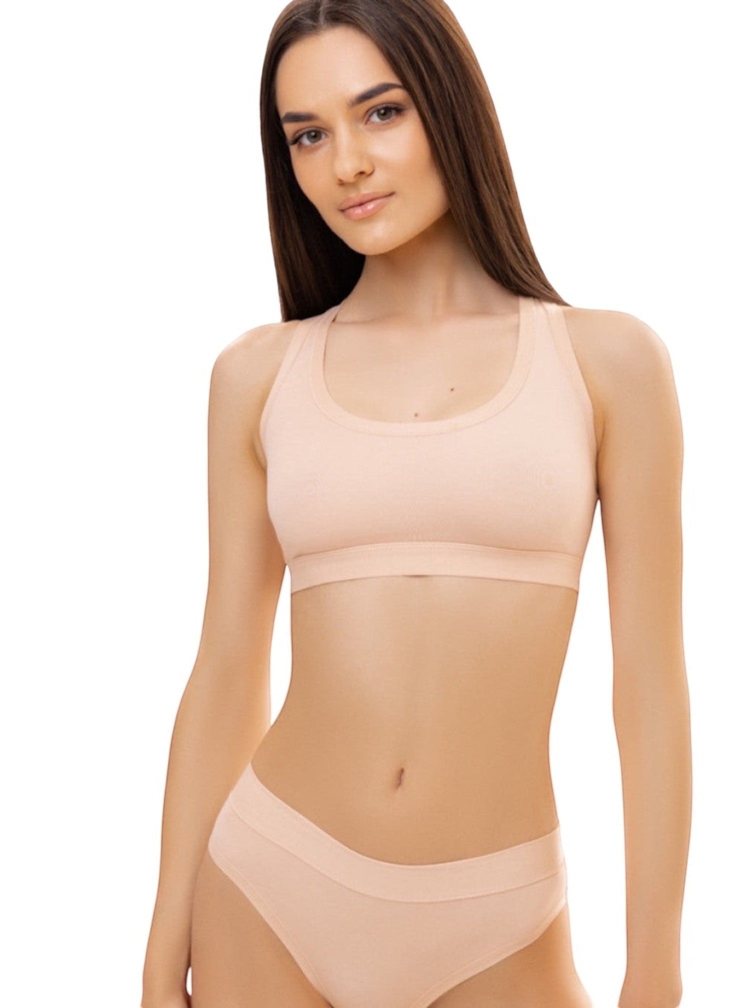 LIA STUDIO LINGERIE Sherly: a beige cotton-spandex sports bra with a sporty cut, wide straps, and no fasteners.
