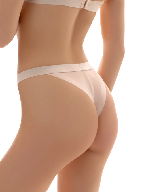 LIA STUDIO LINGERIE Suzan ecru Brazilian mesh panties with a wide elastic waistband on a model.