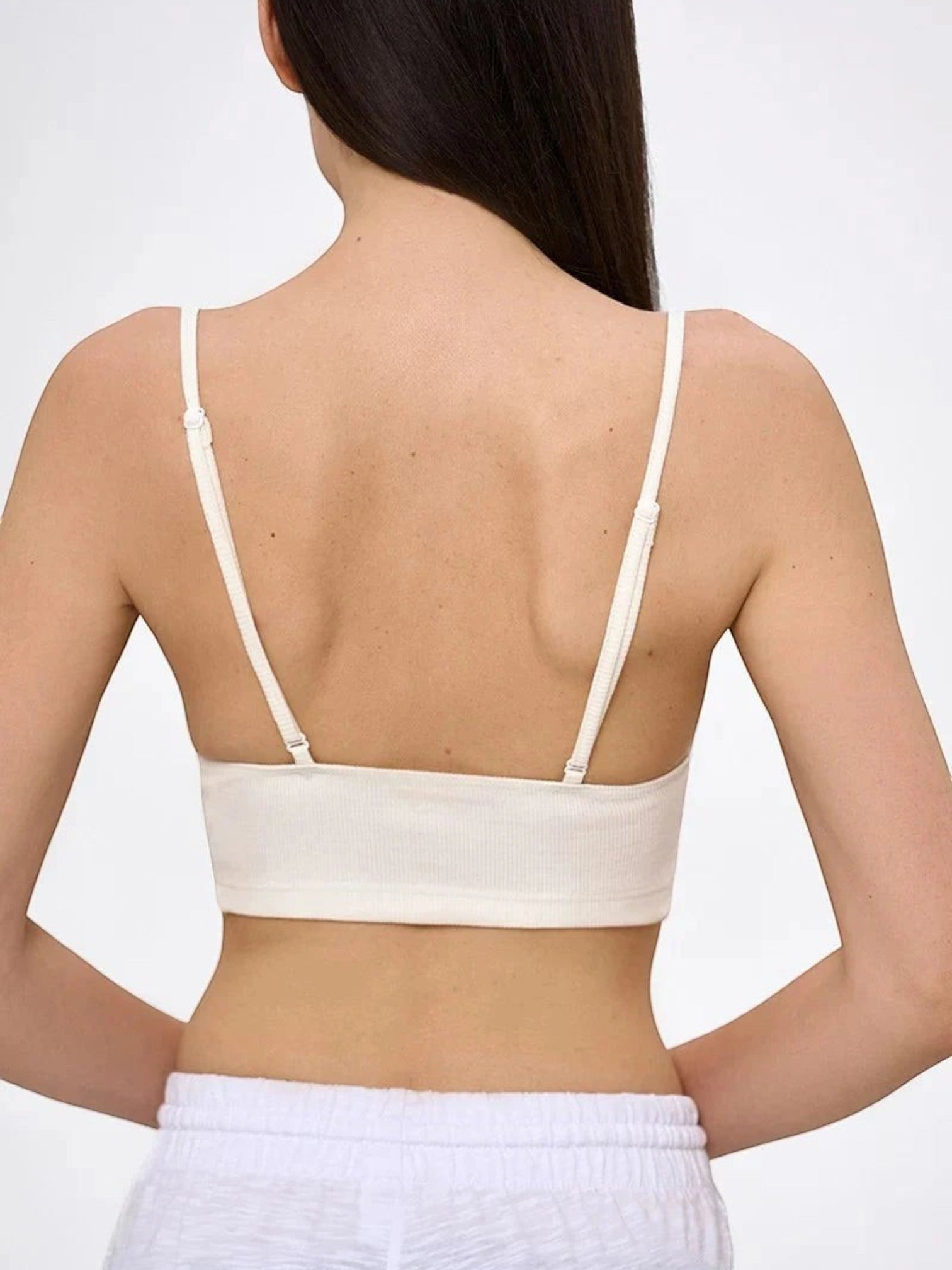 Back view of LIA STUDIO LINGERIE Velia milk white ribbed cotton cropped top with adjustable straps on a model